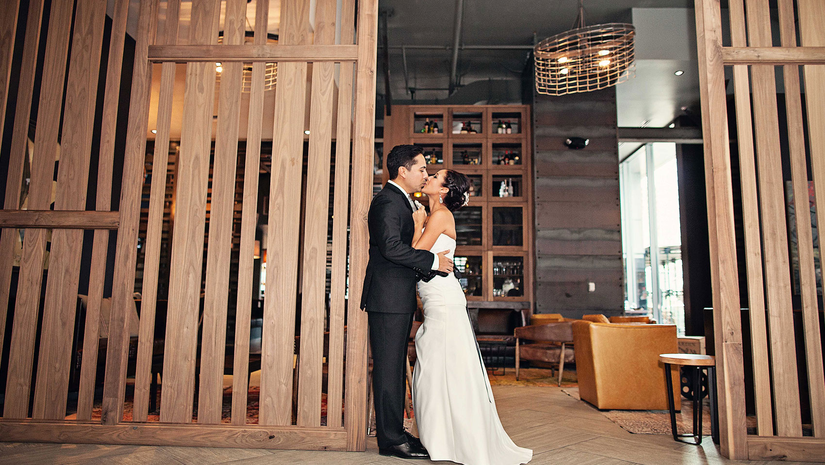 Bride and groom in front of Blue Hound Kitchen