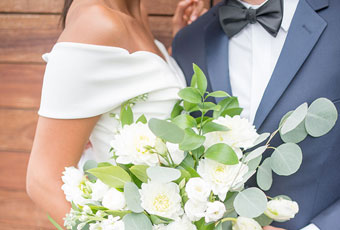 bride and groom with a bouquet